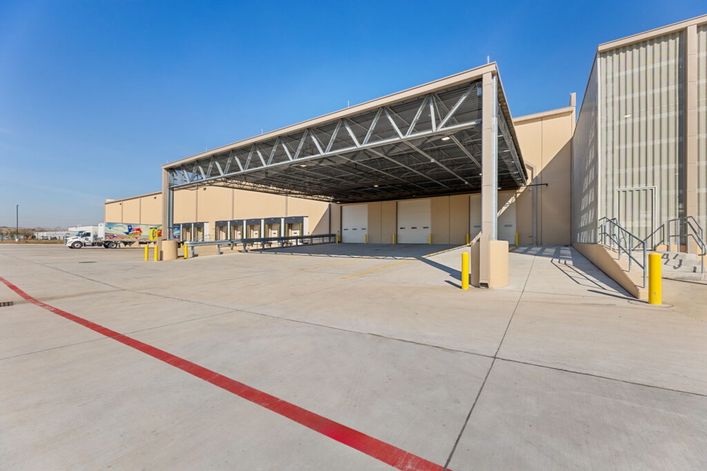 Faust Distributing Company - Warehouse Exterior Loading Dock Warehouse and distribution facility exterior loading dock with canopy, and dock doors.